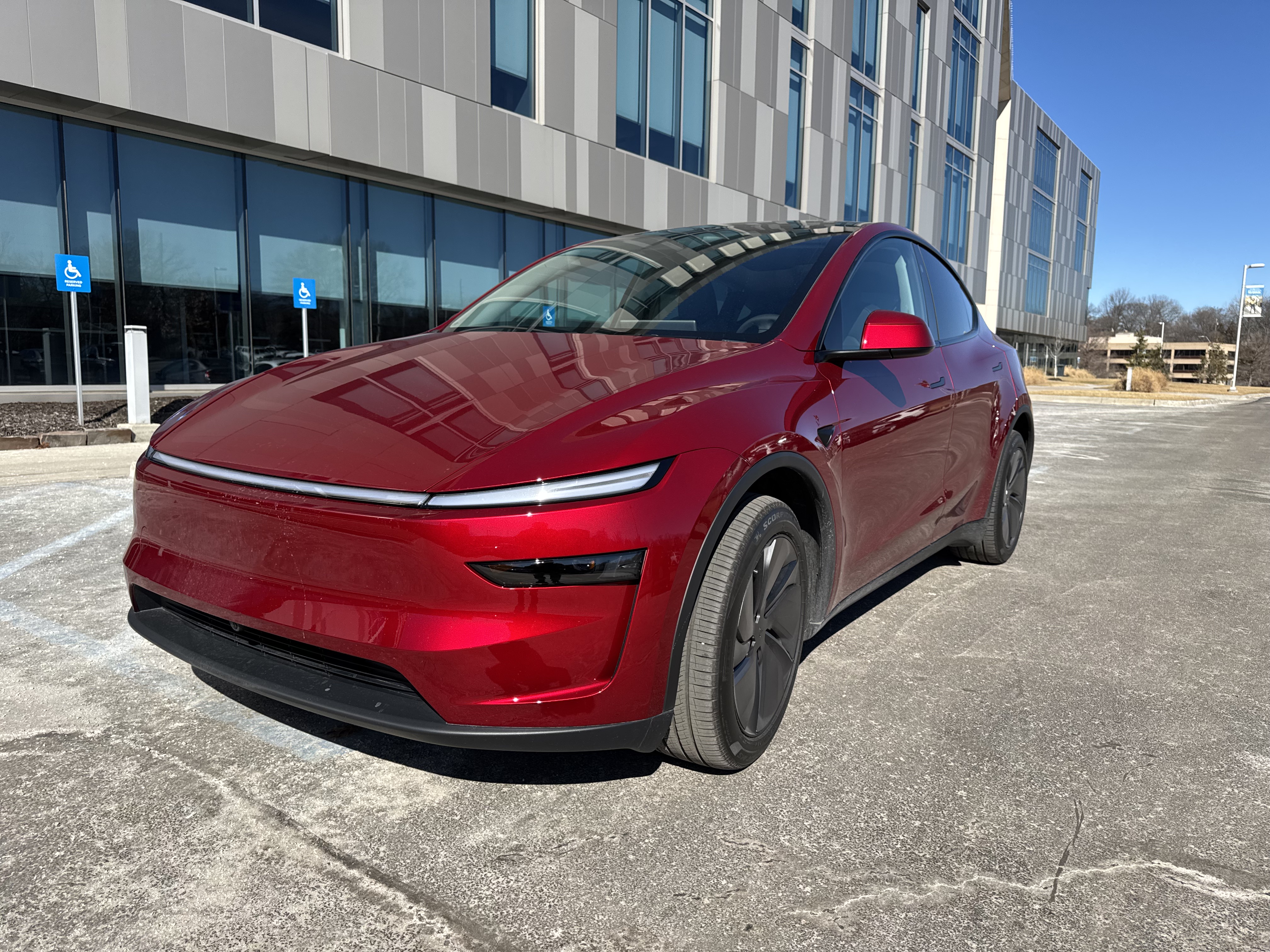 Midnight Cherry Red Tesla Model Y Juniper parked in Kansas City