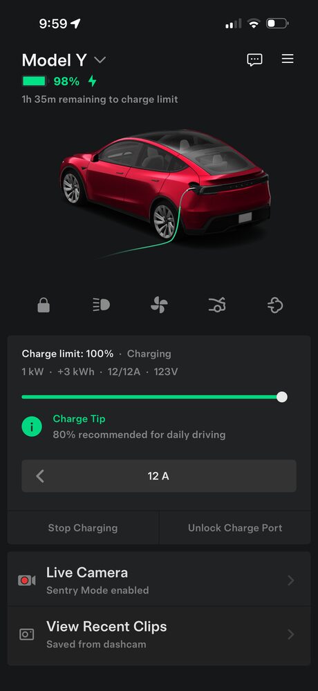 Tesla app charging screen: Model Y at 98%, 1h 35m remaining on a standard household outlet.